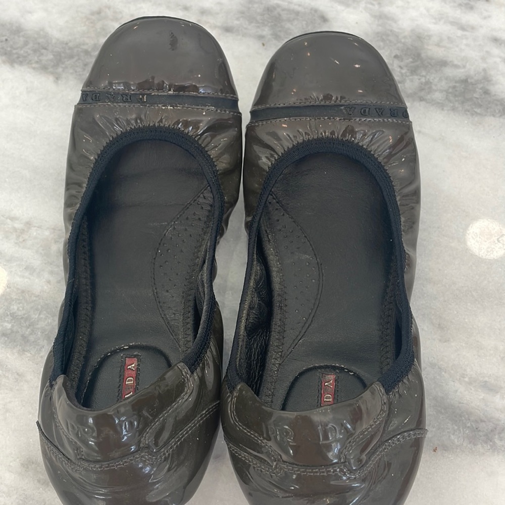Grey patent PRADA flats